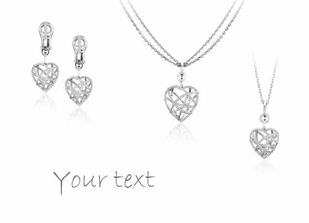 Luxury set of pendant and heart shaped earrings with diamonds on white background