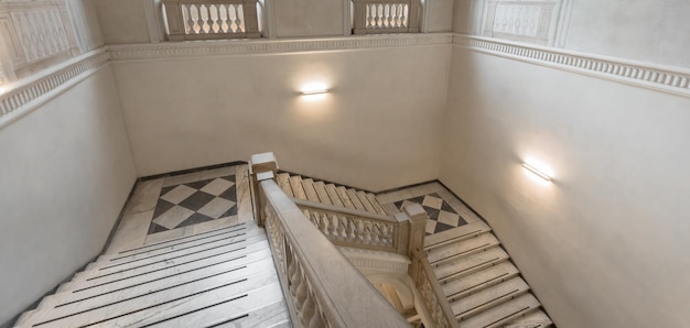 Luxury staircase made of marble in an antique Italian palace