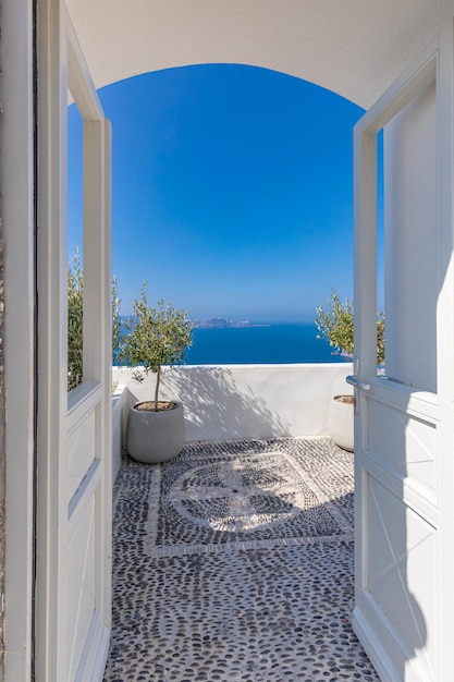 Luxury summer travel vacation landscape. Swimming pool with sea view. White architecture Santorini