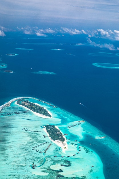 Luxury travel landscape Maldives aerial view tropical resort on paradise island sea atoll reef