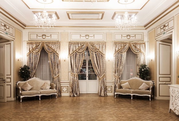 Luxury vintage interior with an aristocratic style. A pompous room with windows