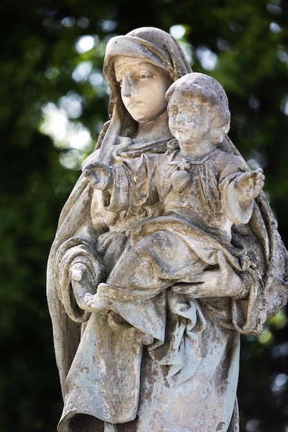 Lviv, Ukraine - May 25, 2020: Old Lychakiv Cemetery in Lviv. Old statue on grave in the Lychakivskyj cemetery