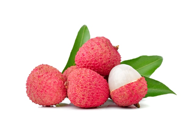 Lychee fruit with leaves isolated on white surface