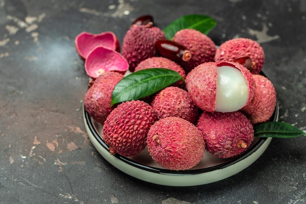 lychees Ripe lychee Exotic asian fruits on a dark background Long banner format top view