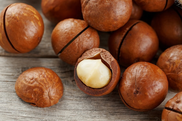 Macadamia nut on a wooden table in a bag