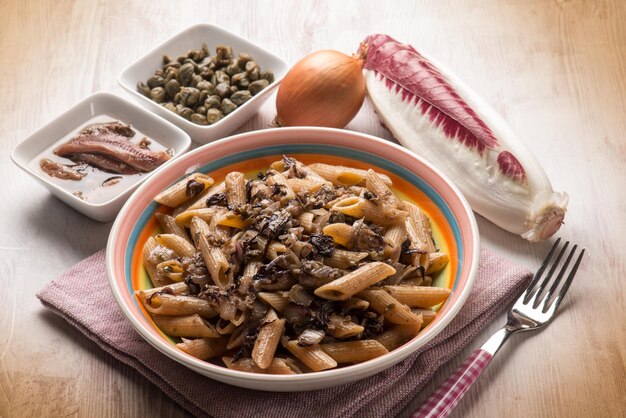 Macaroni with red chicory anchovy and capers