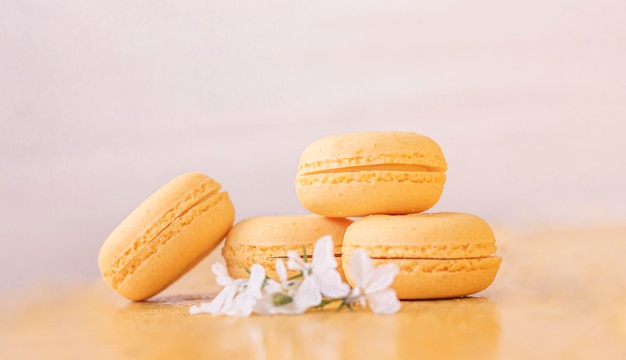 Macaroni with sweet almonds of pale yellow color with white flowers