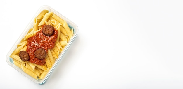 Macaroni with tomato sauce chorizo and cheese in plastic container