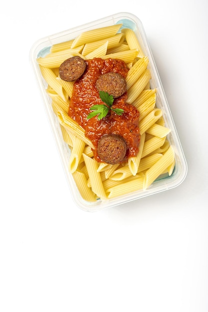 Macaroni with tomato sauce chorizo and cheese in plastic container