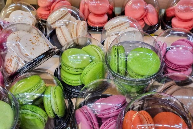 Macarons in plastic packaging. Macaroons multi-colored.