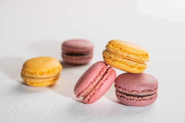 Macarons on white surface colorful french desserts selective focus