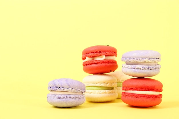 Macaroons on a colored background top view