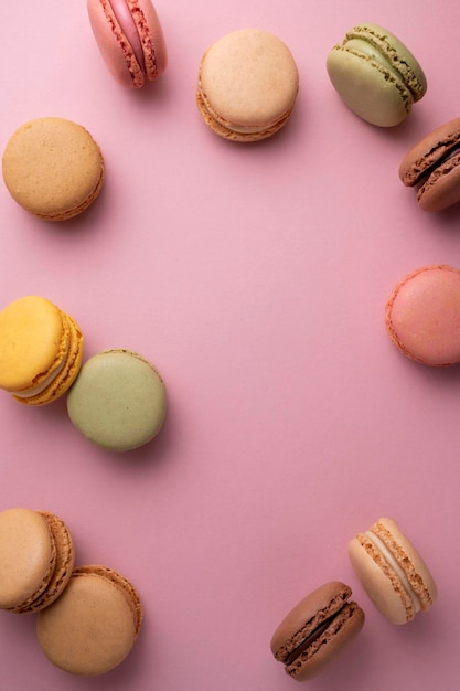 Macaroons colorful cookies Macarons french sweet dessert top view pink background Copy space