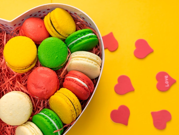 Macaroons in a gift box. Heart-shaped box