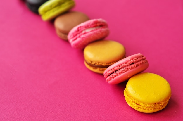 Macaroons on pink with a place under the text