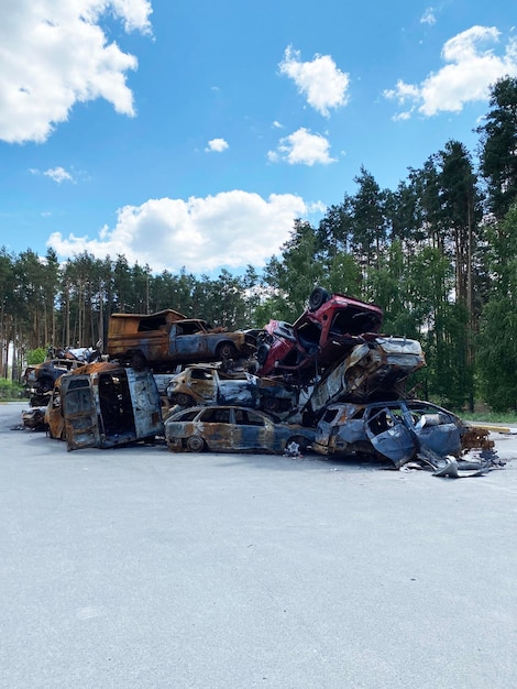 Machine graveyard Dump of shot civilian cars by Russian invaders in Ukraine