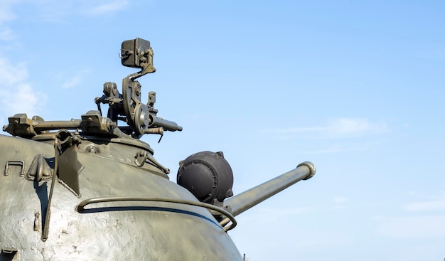 Machine gun on the turret of an armored personnel carrier Heavy weapons of war blue sky background