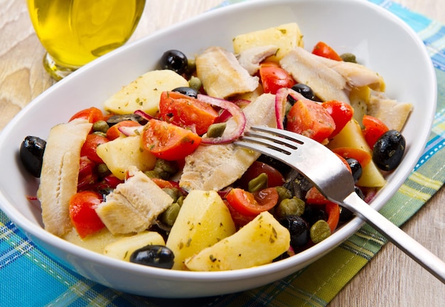 Mackerels with potatoes,tomatoes,capers and olives