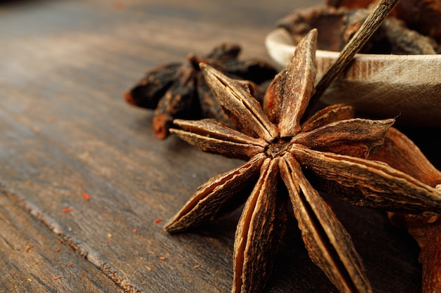 Macro  of anise stars on wooden background