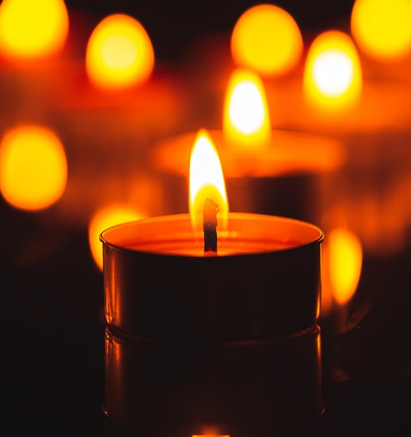 macro candle,Candles Burning at Night. White Candles Burning in the Dark