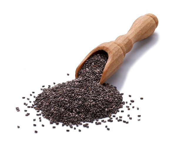 Macro depth of field Chia seeds in a wooden scoop isolated on white background