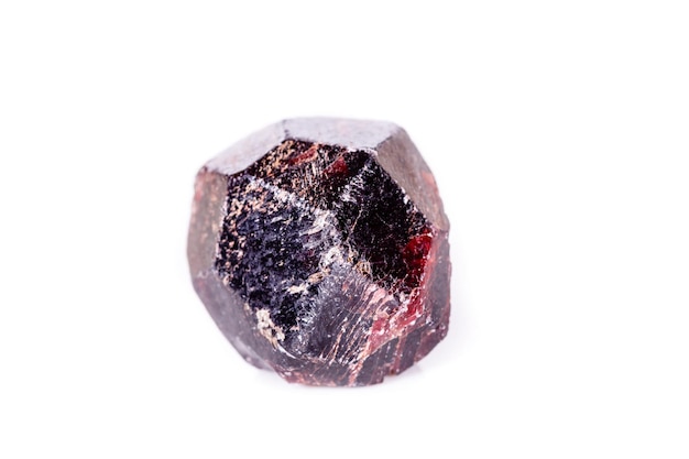 Macro of a mineral garnet stone on a white background