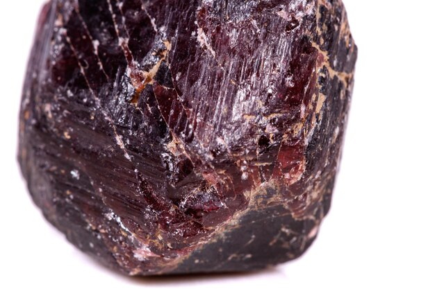 Macro of a mineral garnet stone on a white background