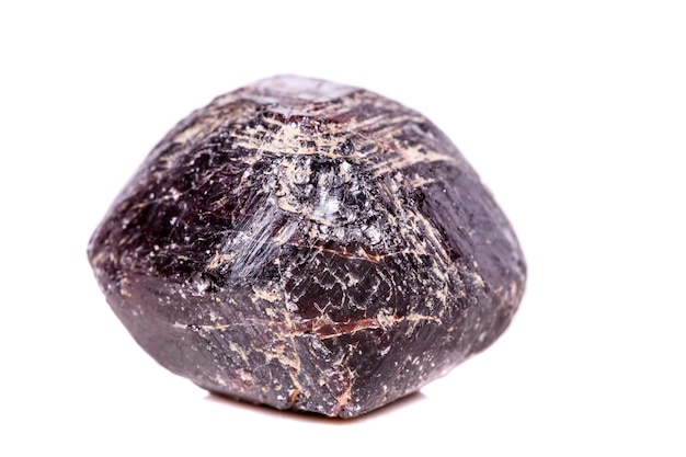 Macro of a mineral garnet stone on a white background