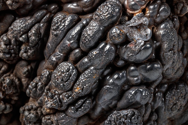 Macro mineral Hematite stone on a white background closeup