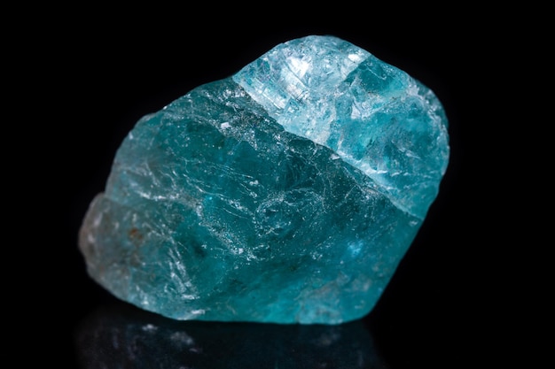 Macro mineral stone apatite on black background