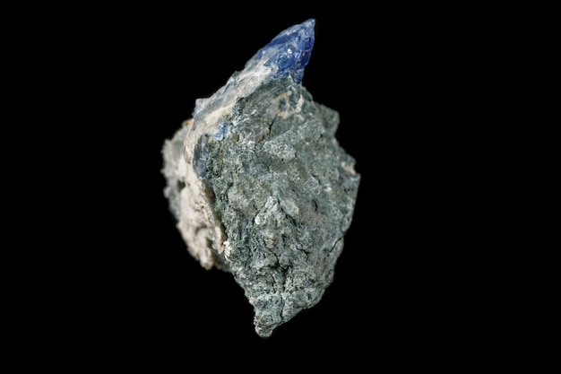 Macro mineral stone Bentorite on a black background