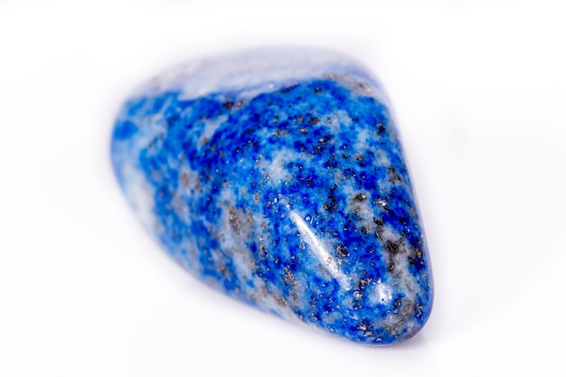 Macro mineral stone blue lapis lazuli afghanistan on white background