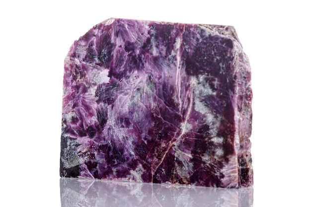 Macro mineral stone Charoite on a white background