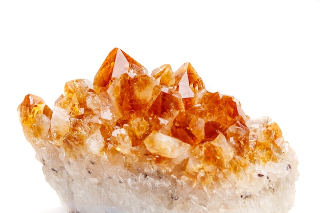 Macro mineral stone Citrine in rock in crystals on a white background