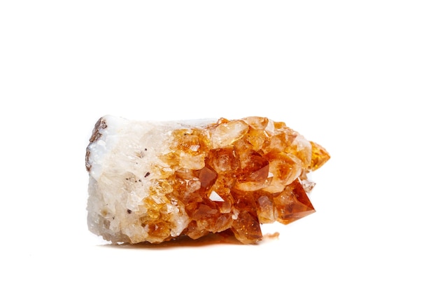 Macro mineral stone Citrine in rock in crystals on a white background