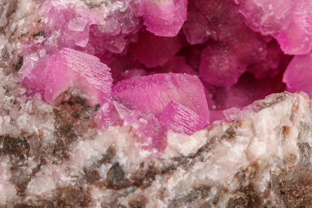 Macro mineral stone Cobalt Calcite rock on white background