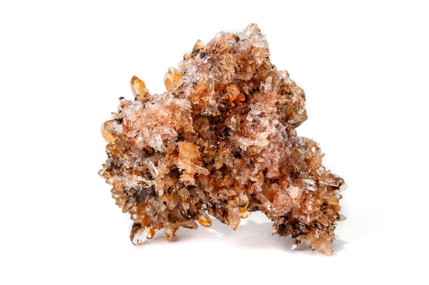 Macro of mineral stone Creedite on microcline on white background