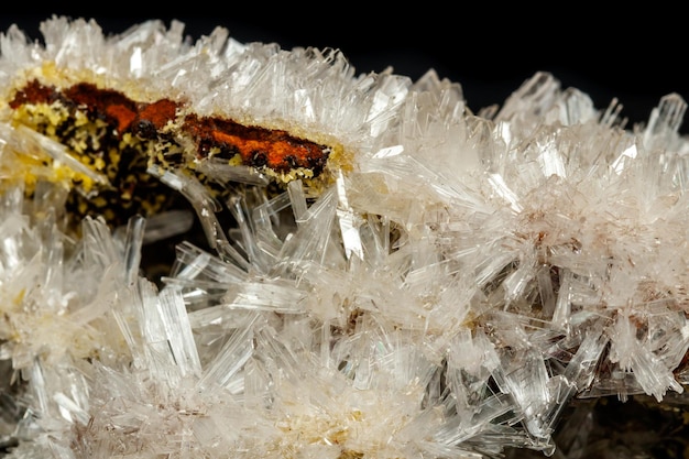 Macro mineral stone crystals Hemimorphite rock on a black background