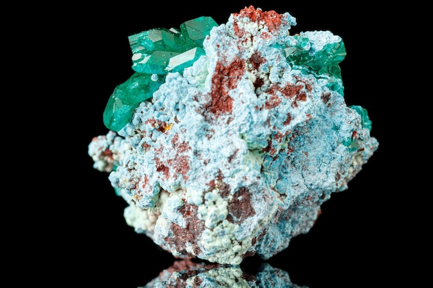 Macro mineral stone Dioptase on a black background