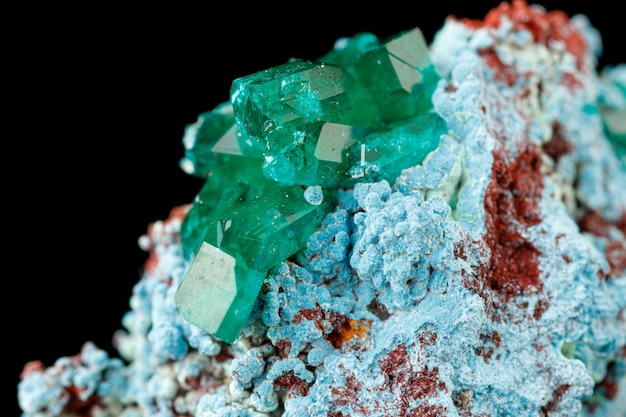 Photo macro mineral stone dioptase on a black background