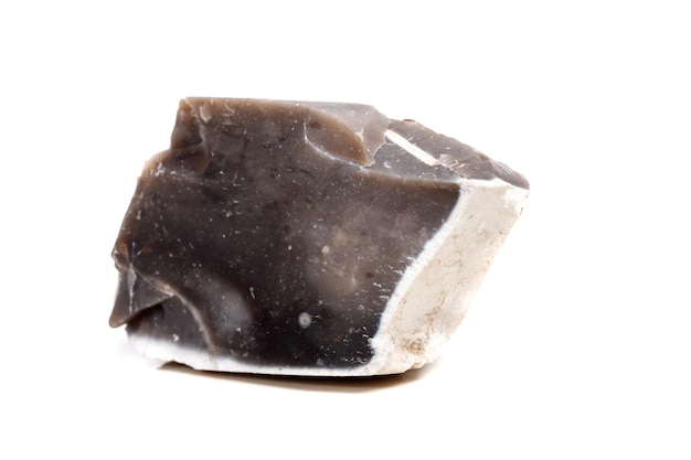 Macro mineral stone Flint in the rock on a white background