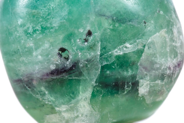 Photo macro mineral stone fluorite crystal on a black background