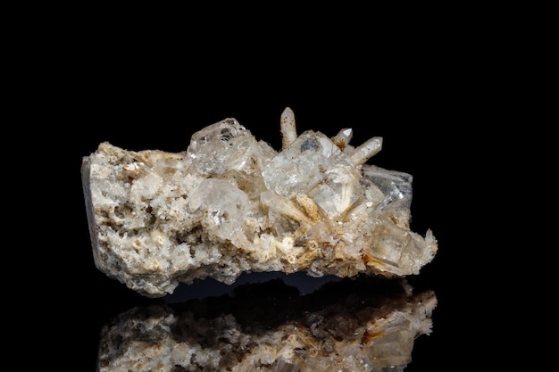 Macro mineral stone fluorite with quartz against black background