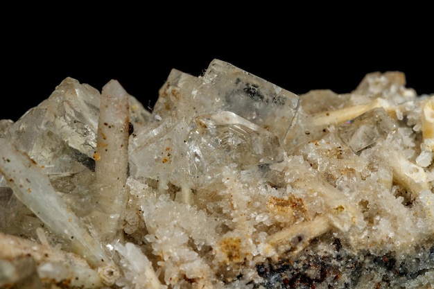 Macro mineral stone fluorite with quartz against black background