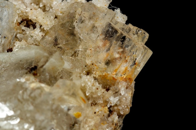 Macro mineral stone fluorite with quartz against black background