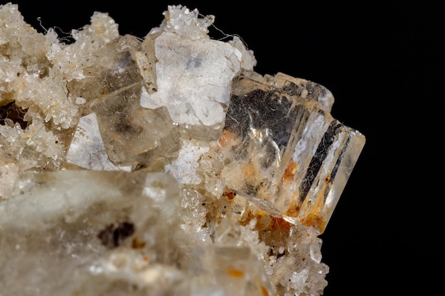 Macro mineral stone fluorite with quartz against black background