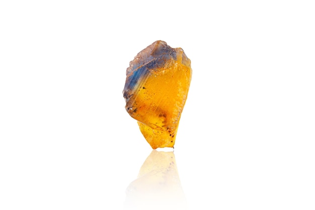 Macro mineral stone Fluorite yellow and blue color on a white background closeup