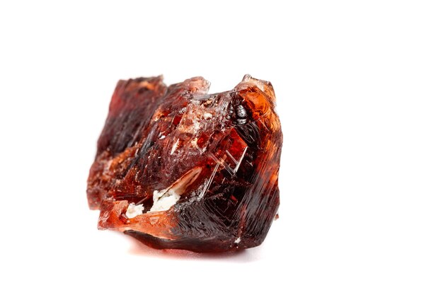 Macro mineral stone Garnet Spessartine on a white background