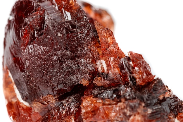 Macro mineral stone Garnet Spessartine on a white background