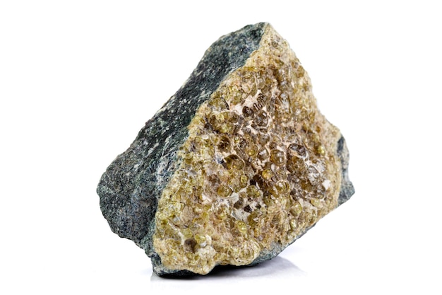 Macro mineral stone grossular on a white background